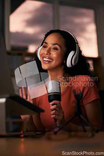 Image of Woman, headphones and microphone, radio DJ or podcast with journalist and live media broadcast at night. Happy, tech and multimedia, communication and social media streamer with content creation