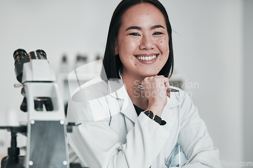 Image of Science, microscope and portrait of Asian woman in laboratory for research, analysis and study. Biotechnology, healthcare and happy scientist with equipment for medical innovation, sample and test