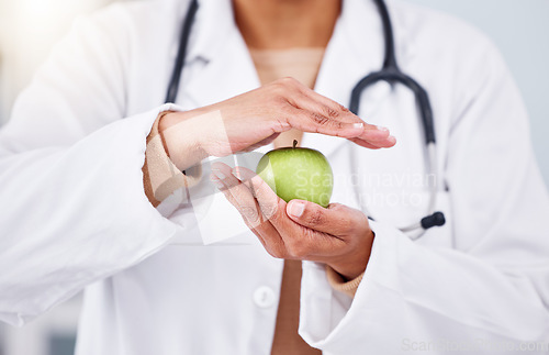 Image of Hands, apple and doctor, health and diet with nutritionist person, healthy food closeup and lose weight. Dietician, healthcare and wellness, green fruit and clean eating with vegan, organic and fiber