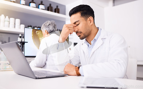 Image of Scientist, pain and headache for computer research, pharmaceutical fail or data analysis, mistake or laboratory results. Sad, fatigue or tired science man or medical doctor on laptop for job crisis