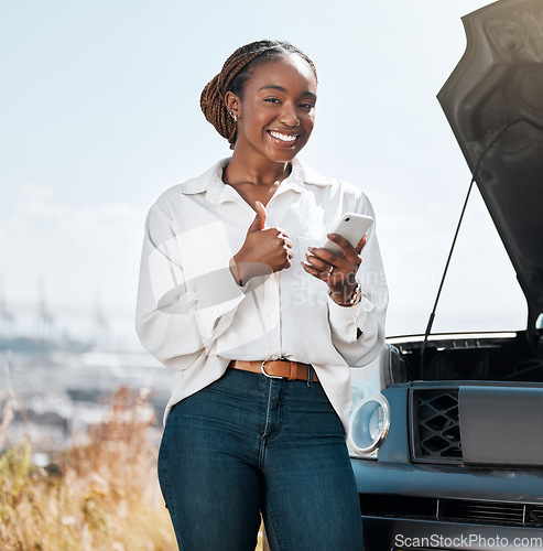 Image of Car insurance, phone or portrait of happy woman with thumbs up on road typing message for help. Smile, service or African driver by a stuck motor vehicle texting on social media mobile app or online