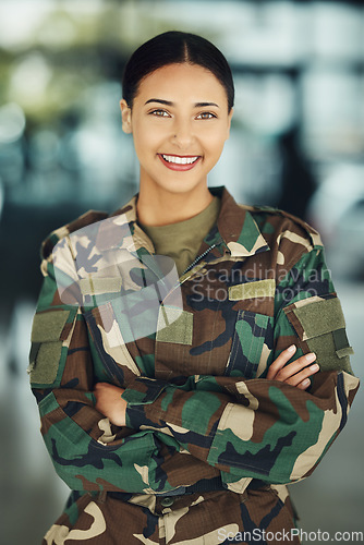 Image of Portrait, military and woman with arms crossed, smile and war with protection, confident and power. Person, security and lady warrior proud, hero and ready for army, service or training for combat
