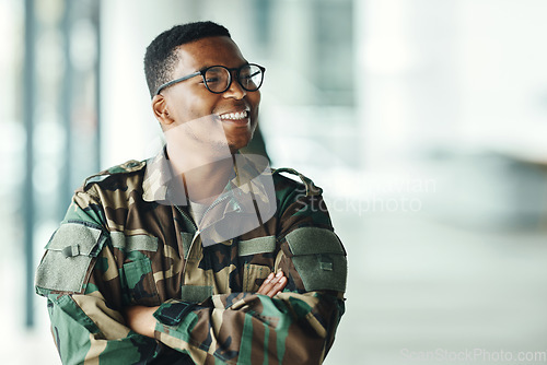 Image of Soldier with smile, confidence and arms crossed at army building, pride and happy professional in sevice. Military career, security and courage, black man in camouflage uniform at government agency.