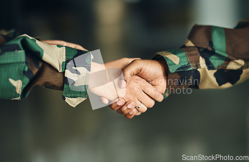 Image of Meeting, army or shaking hands for partnership, teamwork or deal in war, agreement or unity together. Closeup, soldiers or handshake for team fight, thank you or gratitude in solidarity or military