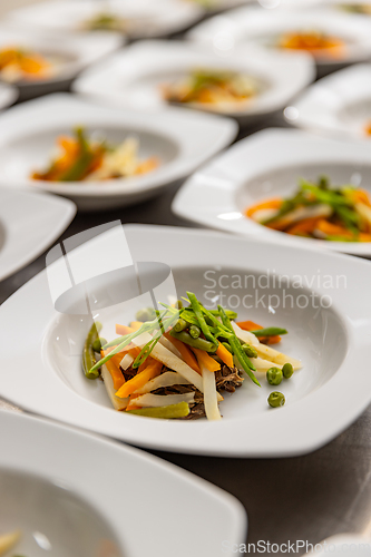 Image of Original serving of soup in a restaurant.