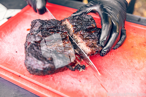 Image of Cutting delicious roast beef meat