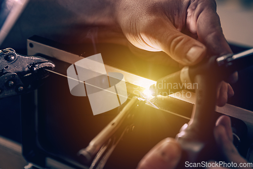 Image of Metal welder works with a steel welder