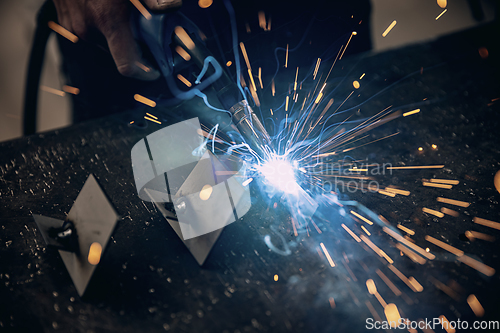 Image of Worker welding the iron