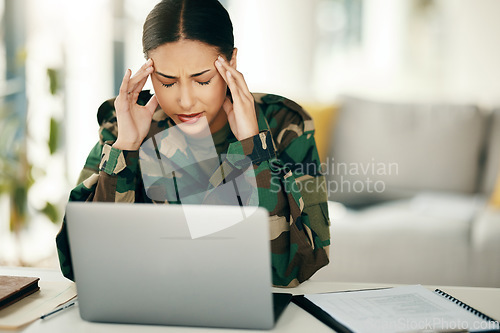 Image of Headache, stress or woman soldier with trauma and depression at desk with anxiety on laptop. Frustrated, psychology or sad person with army memory, military frustration or ptsd crisis typing online