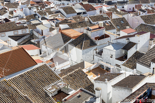 Image of Aerial panoramic view of rooftops of white houses of Olvera town, considered the gate of white towns route in the province of Cadiz, Spain