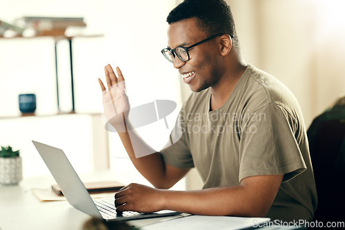 Image of Laptop, man and communication with wave for remote work, video call and conference in home office with happiness and glasses. Computer, employee and person in conversation or online seminar for job