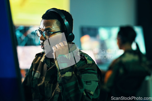 Image of Military, control room and man on computer in office, data center and monitor for technical support, cybersecurity or surveillance. Army, officer or work in tech, security or government communication