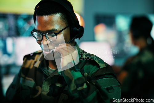 Image of Control room man, surveillance and military communication, army risk dispatch or security telecom advice. Headset, 911 emergency consultation and African soldier consulting on intel support service