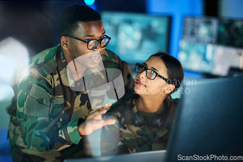 Image of Night training, army and people with a computer for communication, planning strategy or surveillance. Cyber security, data center and a black man talking to a woman about monitor in a military room