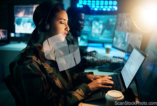 Image of Army command center, laptop and woman in headset, global surveillance and tech communication. Security, intelligence and soldier at computer in military office at government cyber data control room.