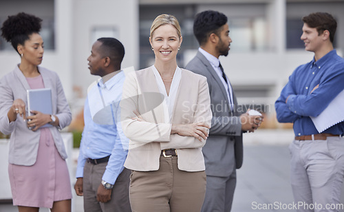 Image of Business, portrait and woman with hands crossed for leadership and teamwork on rooftop of office building with collaboration. Team, people and professional employee in human resources and corporate