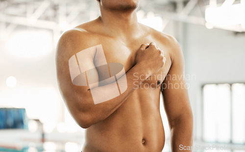 Image of Athlete, man and hand on chest with pride for national anthem at sport event or olympic competition by indoor swimming pool. Swimmer, person and shirtless for fitness, performance or lifestyle
