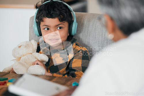 Image of Education, headphones and teaching with child and grandmother for homework, helping and studying. Learning, happy and math with boy and woman in family home for assessment, exam and knowledge