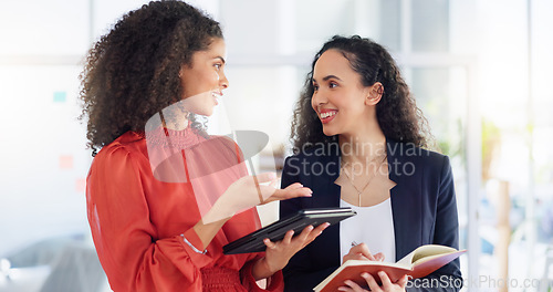 Image of Teamwork, planning and review with women in office for discussion, commitment and collaboration. Tablet, notebook and conversation with employees talking for advice, development and strategy meeting