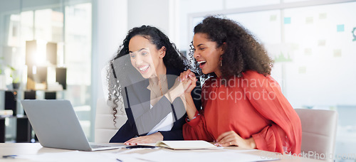 Image of Laptop, success and business women high five to celebrate goals, targets or achievement in office. Winner, wow surprise and happy friends or employees in celebration of winning, promotion and bonus.