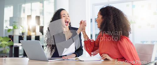 Image of Laptop, success and business women high five to celebrate goals, targets or achievement in office. Winner, wow surprise and happy friends or employees in celebration of winning, promotion and bonus.