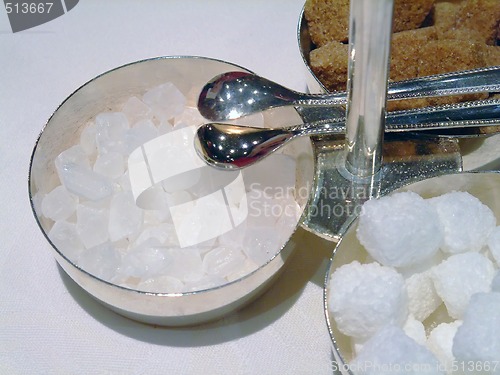 Image of Candy sugar cubes with tongs