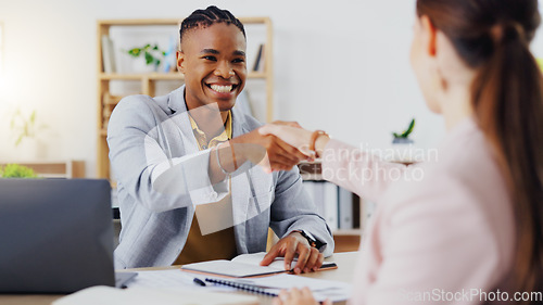 Image of Businessman, interview and handshake for hiring, partnership or agreement in recruitment at the office. Happy employer shaking hands with employee or new recruit for meeting, greeting or deal at desk