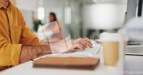 Image of Hands, typing and person with keyboard, journalist writing article on computer at startup and creativity. Copywriting, productivity with research online, workflow and content creation at office desk