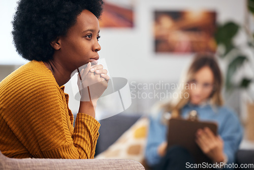 Image of Mental health, anxiety and psychology with a black woman in therapy, talking to a professional. Depression, stress or support with a young patient in session with a psychologist for grief counseling