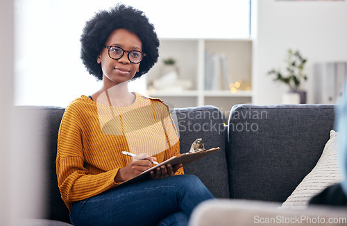 Image of Psychologist on sofa, writing notes and listening to patient, advice and help in psychology for mental health care. Conversation, support and black woman on couch with client, therapist in counseling