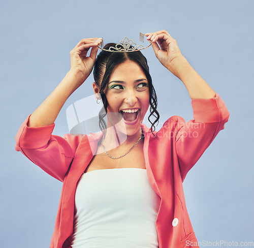 Image of Fashion, beauty and woman with crown in studio for glamour, luxury and winning prize. Excited, wow and isolated person with tiara for princess pride, confidence and cosmetics on purple background