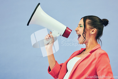 Image of Megaphone, speech and woman shouting in studio with news, discount or beauty sale on blue background. Speaker, noise and female model with bullhorn announcement for cosmetic, giveaway or makeup prize