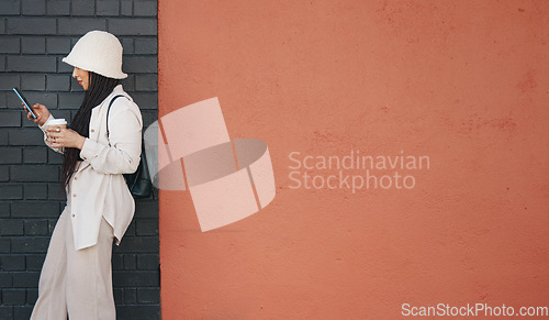 Image of Woman with phone, brick wall and mockup, urban fashion and typing social media post, chat and coffee. Streetwear, gen z girl or online influencer with smartphone, communication and relax on red space