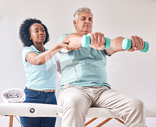 Image of Old man, exercise and physiotherapy with dumbbell for wellness and muscle training on bed with black woman. Healthcare, physiotherapist and senior with workout for healing help, support and fitness