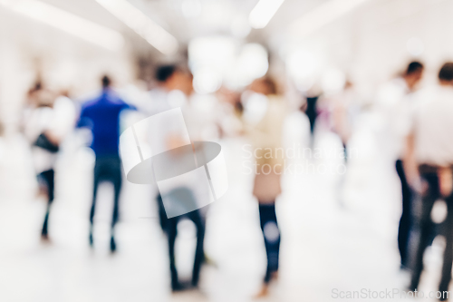 Image of Abstract blurred people socializing during coffee break at business conference.