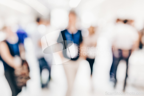 Image of Abstract blurred people socializing during coffee break at business conference.