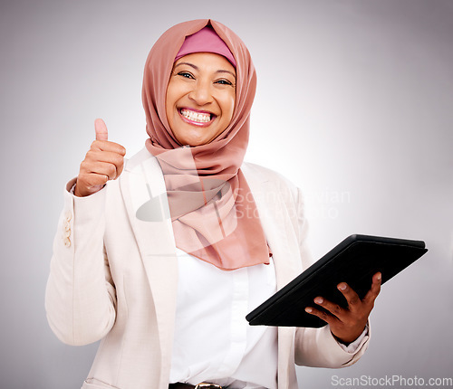 Image of Muslim woman, thumbs up and tablet for success, like and subscribe to human resources website in studio. Portrait of business person in dubai, digital results or HR job support on a white background