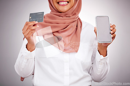 Image of Woman, credit card and phone screen for online shopping, muslim fashion marketing and e commerce in studio. Islamic customer in hijab, mobile mockup and banking app for payment on a white background