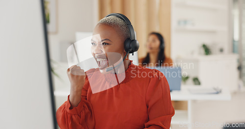 Image of Winner, success and motivation with a black woman in a call center for customer service or support. Wow, target and celebration with a young employee consulting in a crm or telemarketing office
