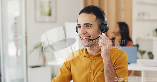 Image of Call center, man and online consulting in office for CRM questions, FAQ contact and IT support. Happy telemarketing agent with communication for sales advisory, telecom solution and offer client help