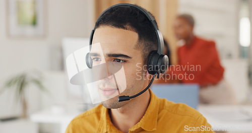 Image of Call center, consultant and face of man in office for CRM questions, FAQ contact and IT support. Telemarketing agent with microphone for sales advisory, telecom solution or offer service at help desk