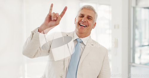 Image of Portrait, rock hand gesture and a senior businessman in the office with a smile for motivation or success. Management, leadership and a happy CEO in the workplace with freedom, energy or horns emoji