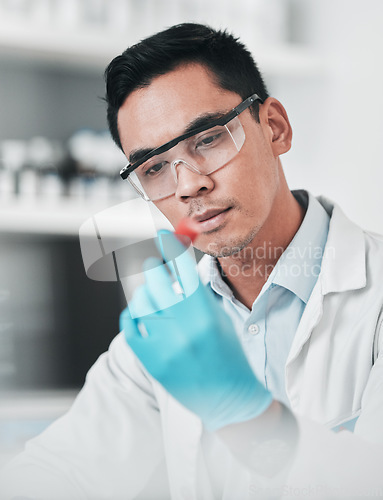 Image of Science, test tube and asian man in laboratory for medical analysis, health inspection and vaccine development. Scientist studying blood sample for dna results, chemistry investigation and assessment