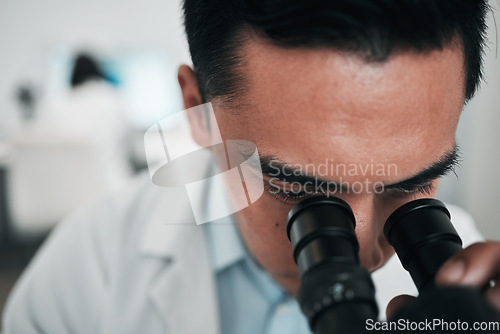 Image of Man, scientist and microscope in forensic study, research or science discovery at laboratory. Closeup of male person, medical or specialist looking in scope for DNA, vaccine or cure to virus in lab