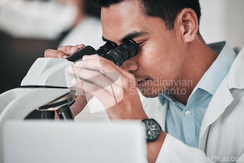 Image of Scientist, man and medical microscope for research, DNA analysis and pharmaceutical investigation with laboratory data. Professional science person, doctor or expert with lens check for healthcare