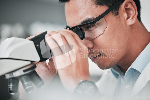 Image of Man, scientist and microscope in forensic discovery, research or science study at laboratory. Closeup of male person, medical or specialist looking in scope for DNA, vaccine or cure to virus in lab