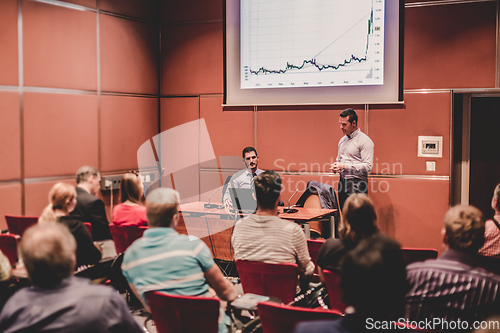 Image of Business speaker giving a talk at business conference meeting event.