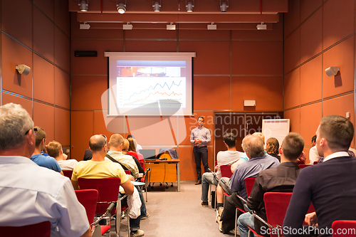 Image of Business speaker giving talk at business conference event.