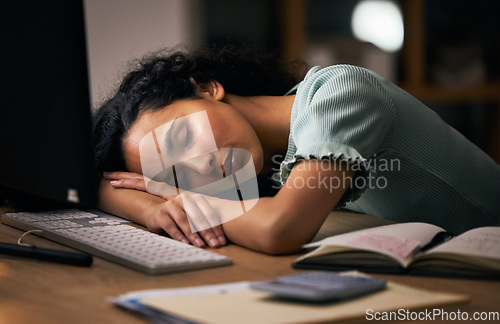 Image of Night, business, and woman sleeping, tired and overworked with burnout, stress and exhausted in a workplace. Dark, person or employee with fatigue, nap at a desk and deadlines with rest or low energy