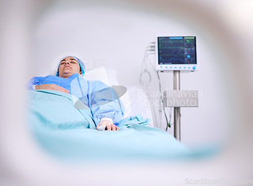 Image of Hospital, cancer and a woman patient in bed for medical surgery or an operation to save her life. Health, medicine and a person sleeping in the bedroom of a clinic for recovery after an accident